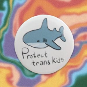 Shark "Protect trans kids" pin